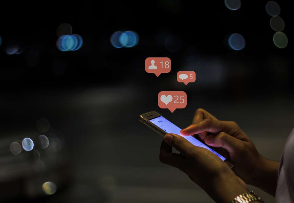 Woman using social media on cellphone