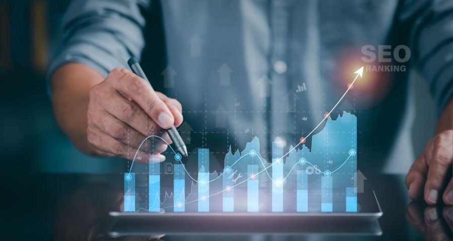 A,Marketer,Holds,A,Pen,Pointing,To,A,Graph,And