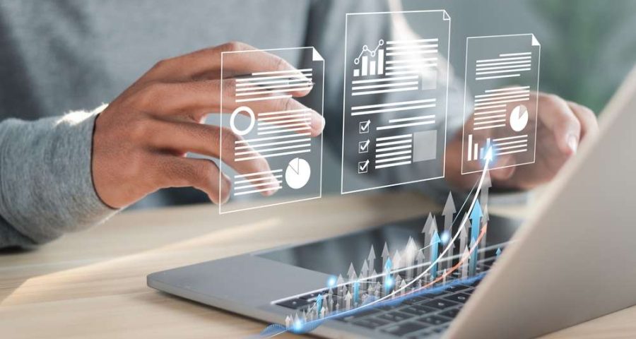 person using laptop with holographic images