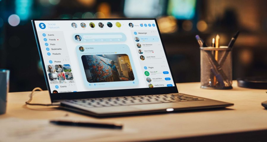 laptop with Facebook open on it with the newsfeed active