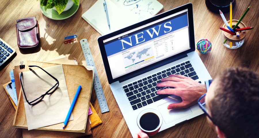 News publication on laptop screen