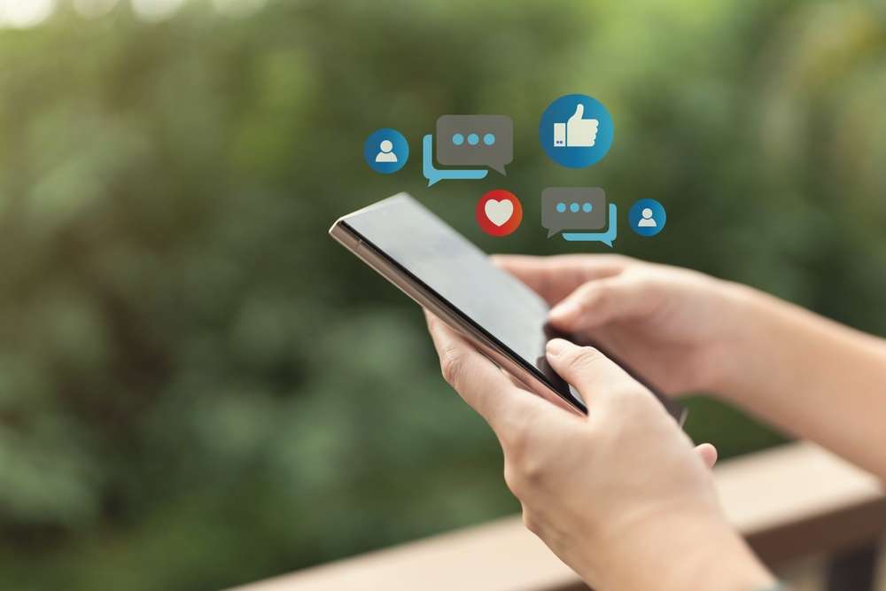 Someone interacting with social media on their phone