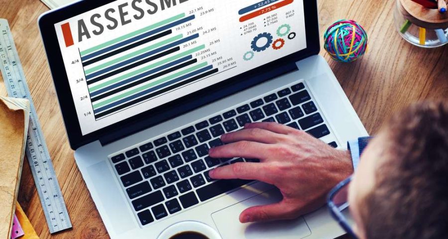 man on computer performing an assessment